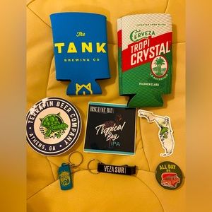 Various beer coozies, stickers, keychains, etc.